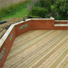 Red brick wall with flint overlay